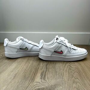 New, without tags, never worn. Nike with velcro swishes.